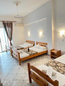 Postel nebo postele na pokoji v ubytování Hotel Katia