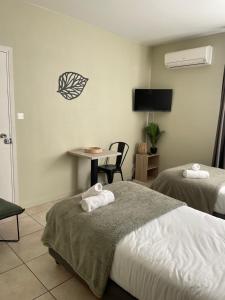 Letto o letti in una camera di Hôtel Pyrène