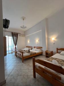 Postel nebo postele na pokoji v ubytování Hotel Katia