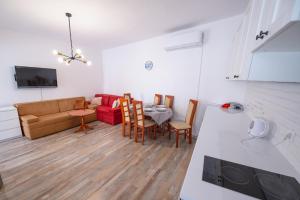 a living room with a couch and a table at Vila Hana in Stolac