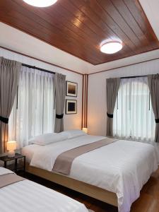 Postel nebo postele na pokoji v ubytování Anna River Home A2