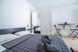 a bedroom with a large bed with shoes on it at Vila Hana in Stolac +98 photos