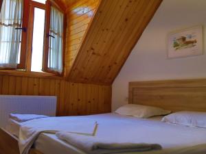 Postel nebo postele na pokoji v ubytování MIK Hotel Valbona