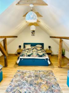a bedroom with a bed in a attic at Domek Nieledwia in Milówka
