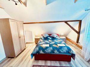 a bedroom with a bed in a room at Domek Nieledwia in Milówka
