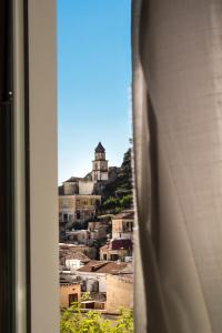 a view of a city from a window at Amalfi Luxury House in Amalfi