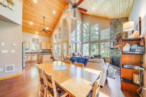 a dining room and living room with a wooden table at Ronald Vacation Rental Near Suncadia Resort in Ronald