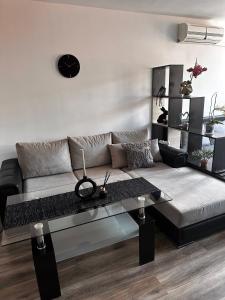 a living room with a couch and a table at Studio X in Sliven