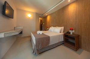 Postel nebo postele na pokoji v ubytování Quinta do Sol Lite Praia Hotel + 24 fotografií