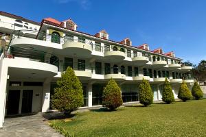 a large white building with trees in front of it at Villasol Hotel in Lunahuaná