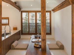 a kitchen with a table and chairs in a room at Stay Ilsang Isang in Jeonju