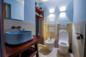 a bathroom with a sink and a toilet at Loft57 L&G - Centro storico in Bari