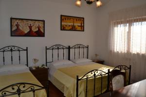 Postel nebo postele na pokoji v ubytování Hotel Canusium