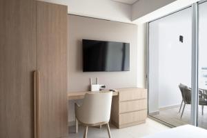 Televiisor ja/või meelelahutuskeskus majutusasutuses Wynwood Cartagena Beach