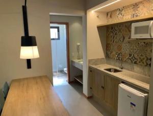 a kitchen with a sink and a counter top at Quinta Santa Bárbara Eco Resort in Pirenópolis