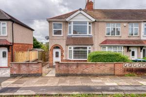 a house with a brick fence in front of it at 3BR Warwick Uni-Free Parking, Fast WiFi in Canley