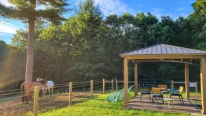 a gazebo with a horse in a field at The Suite at Liberty Woods in Belchertown +29 photos