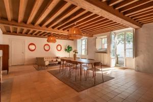a kitchen and dining room with a table and chairs at Domaine la Boissière in Grand Brassac