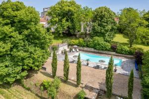 an aerial view of a garden with a swimming pool at Domaine la Boissière in Grand Brassac