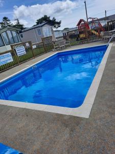 Πισίνα στο ή κοντά στο Amroth Bay holiday caravan