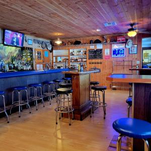 a bar with blue bar stools in a restaurant at Blue Moon Saloon in Cameron