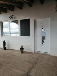 a room with a white door and a large window at CHRIS SOPO in Ohrid