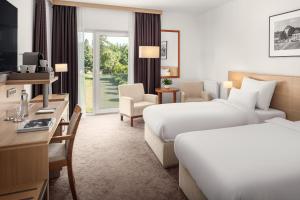 Telewizja i/lub zestaw kina domowego w obiekcie Harvey Spa Hotel