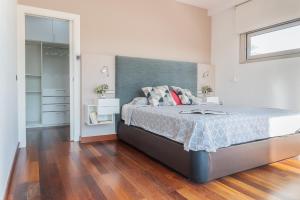 a bedroom with a large bed and a closet at Villa Helios Aguadulce Almeria in Roquetas de Mar +48 photos