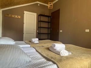 A bed or beds in a room at Hotel Dari