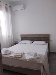 Ένα ή περισσότερα κρεβάτια σε δωμάτιο στο Emvasis Apartments
