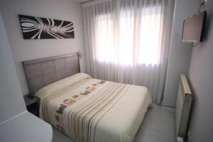 Postel nebo postele na pokoji v ubytování Hostal Santa Barbara
