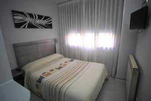 Postel nebo postele na pokoji v ubytování Hostal Santa Barbara