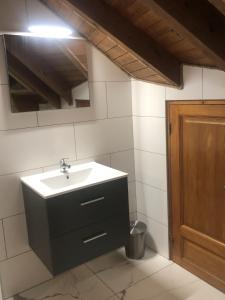 a bathroom with a sink and a mirror at Chalet Leslie in Morzine +32 photos