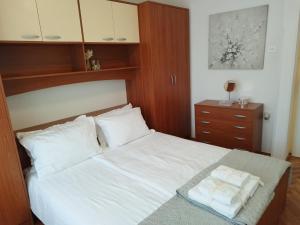 Łóżko lub łóżka w pokoju w obiekcie Antemma Apartment