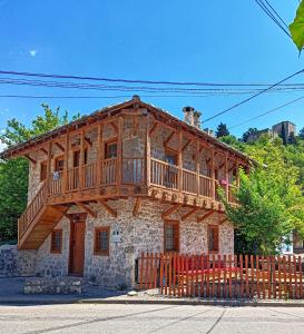 a wooden house with a balcony on top of it at National Monument Konak in Stolac