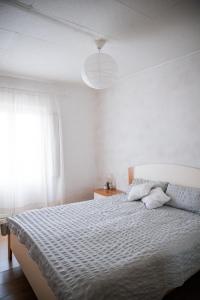 Postel nebo postele na pokoji v ubytování Le Chevalier Apartment