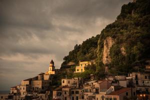a group of houses on a hill with a mountain at Amalfi Luxury House in Amalfi