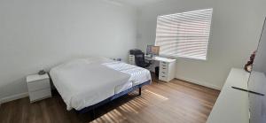 Ένα ή περισσότερα κρεβάτια σε δωμάτιο στο Rent W Palm Beach