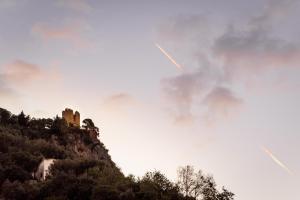a castle on top of a mountain in the clouds at Amalfi Luxury House in Amalfi