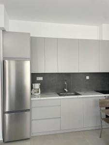 Kuchyň nebo kuchyňský kout v ubytování Kyma Luxury Suite