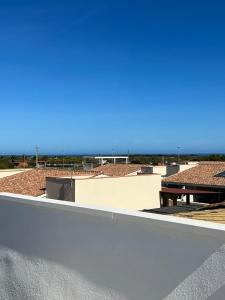 a view of the beach from the roof of a building at Villa Adele in Valledoria +4 photos