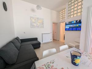 a living room with a couch and a table at Louis House ad Agerola per Amalfi Positano Pompei in Agerola