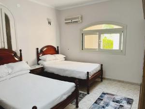 Ένα ή περισσότερα κρεβάτια σε δωμάτιο στο Garden Challet