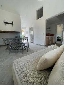 a bedroom with a bed and a table and chairs at Monte da Lua in Montargil