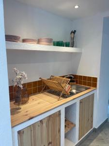 a kitchen with a sink and a counter top at Monte da Lua in Montargil +9 photos
