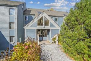 a home with a pathway leading to the front door at Three bedroom condo, Ski home Whiffletree E7 in Killington