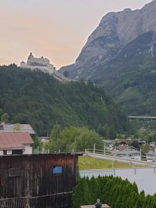 a view of a castle on a mountain at Weisses Rössel-Cavallo Bianco in Werfen