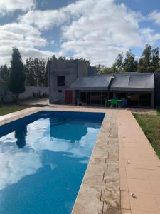 a swimming pool in front of a building at Villa avec piscine in Safi