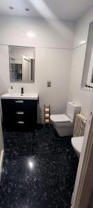 a bathroom with a sink and a toilet and a mirror at El Mirador De San Juan in Zamora +15 photos