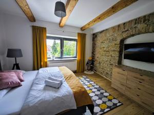 Postel nebo postele na pokoji v ubytování APARTMÁNY 91 Boží Dar